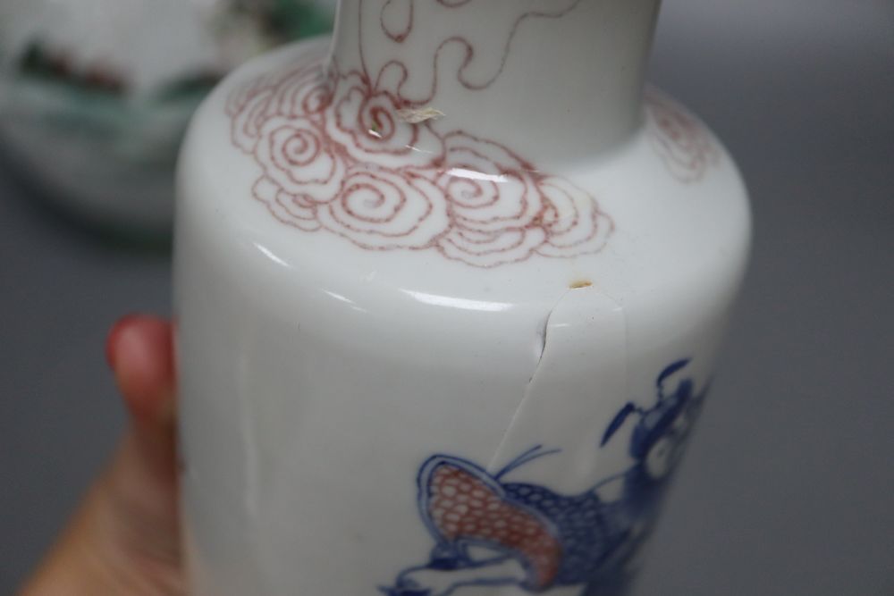 A Chinese famille verte bottle vase, an underglazed copper rouleau vase and a peacock, tallest 38cm